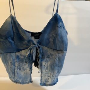 Blue crop top, belly top, new with tags size large. Ties in the front.